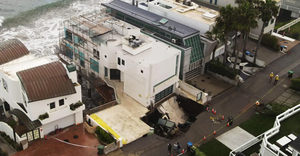 A sinkhole swallowed Nicolas Cage’s driveway. It’s a warning for every coastal neighborhood.
